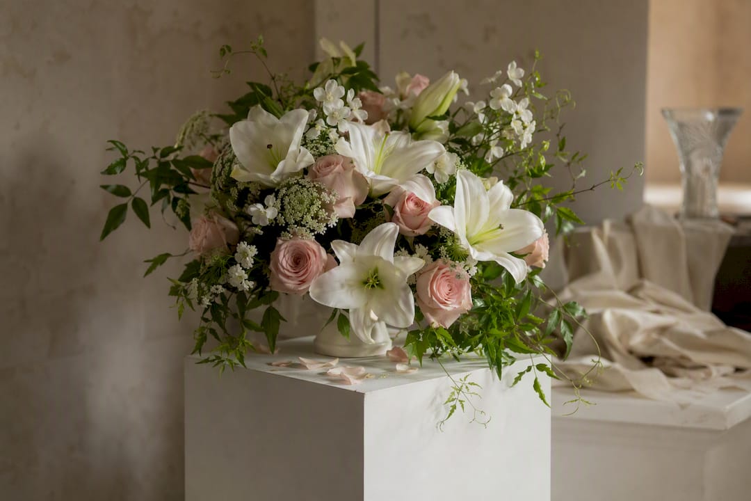 Sympathy flower arrangement on pedestal