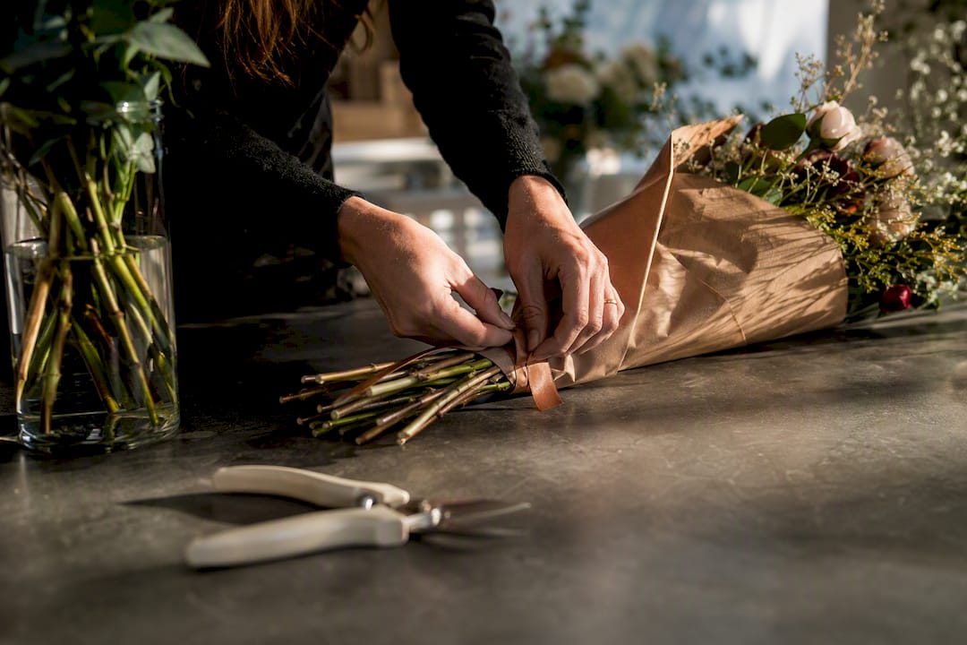 Florist preparing fresh flowers for same-day delivery