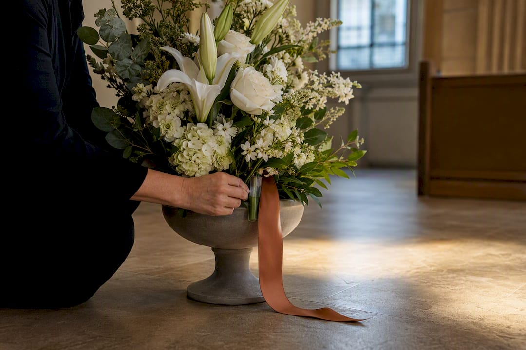 Cropped sympathy flowers prepared for a service