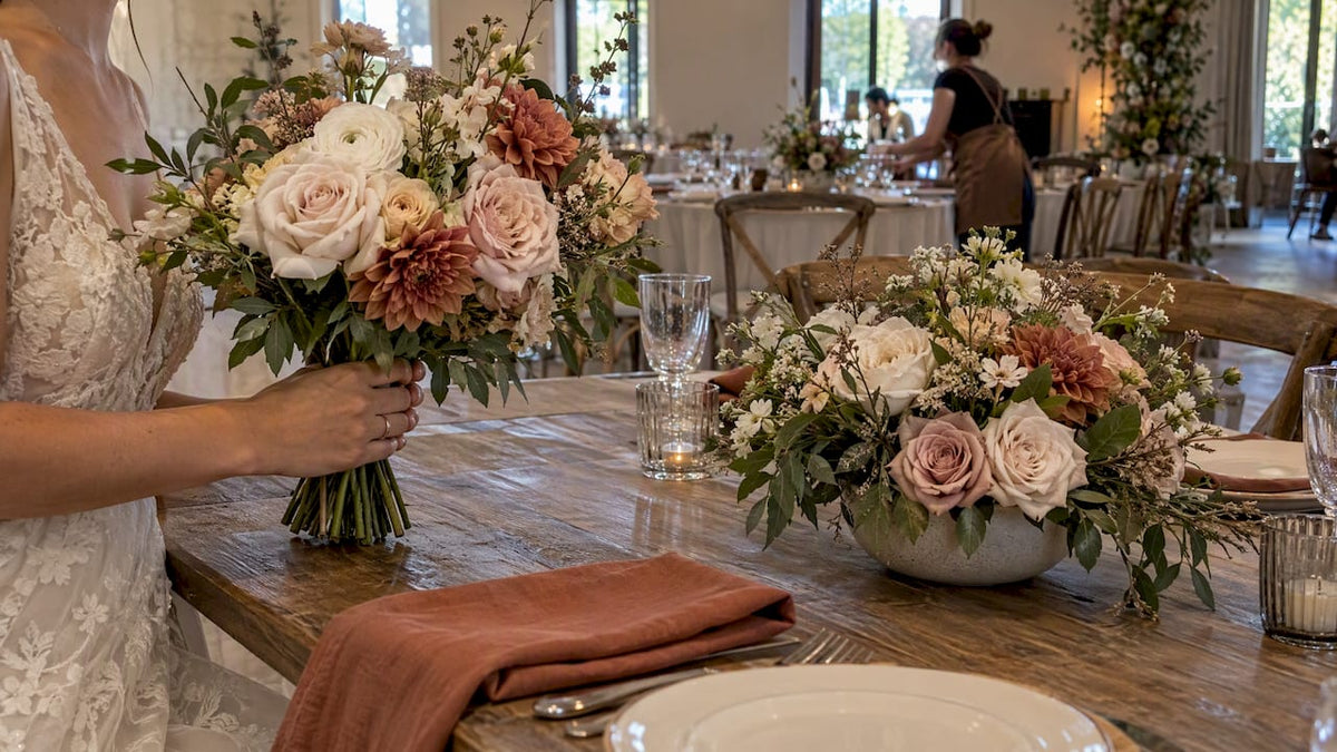 Wedding bouquet beside low table centerpiece