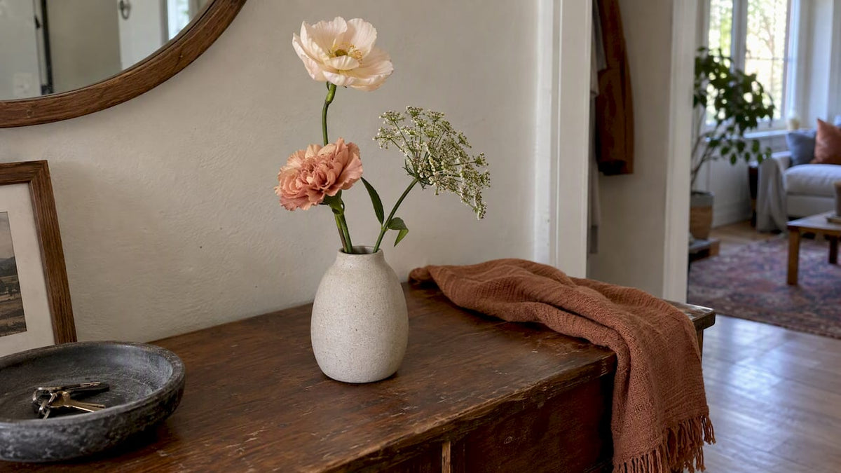Minimalist trio of flowers in ceramic vase