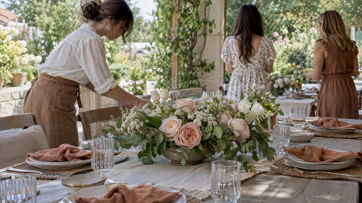 Bridal shower centerpiece among patio place settings