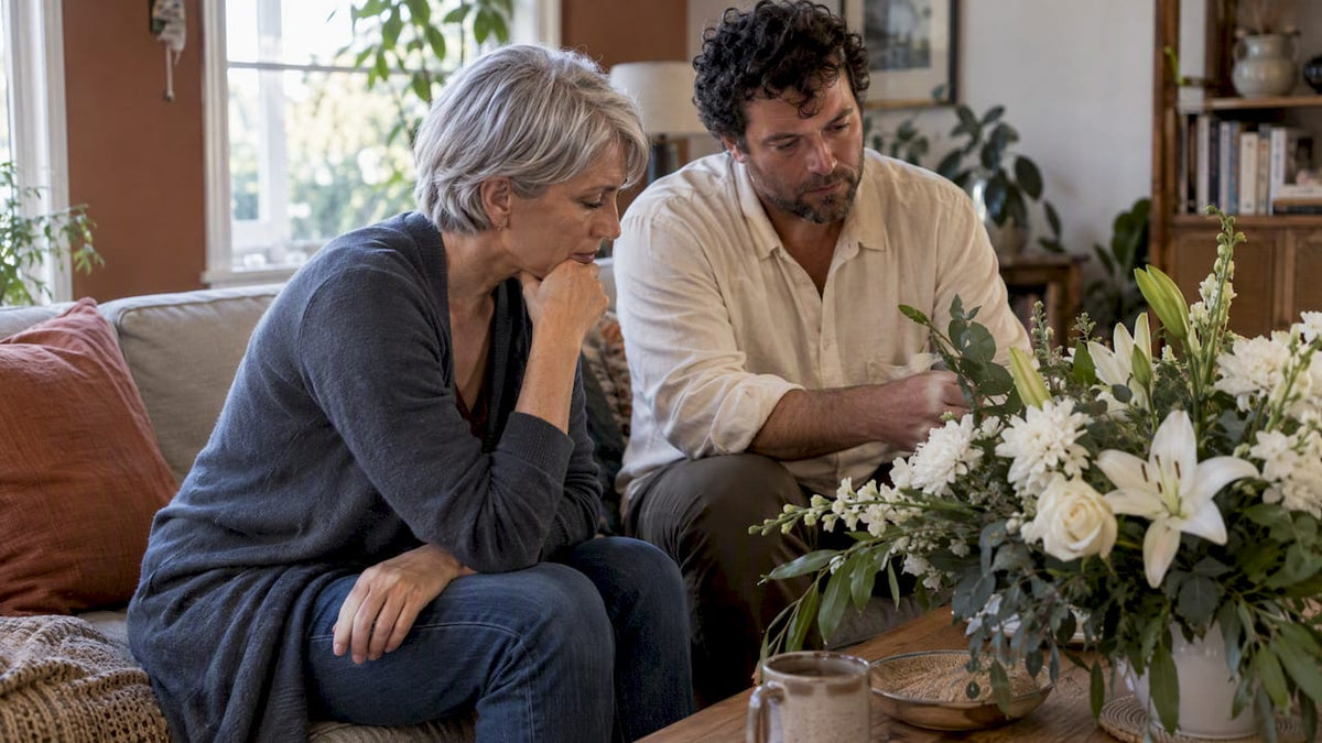 Family discussing funeral flowers at home