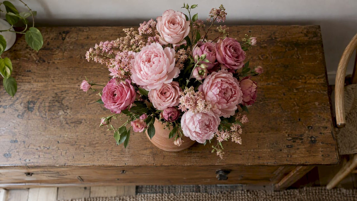 Tonal pink bouquet in a terracotta vase