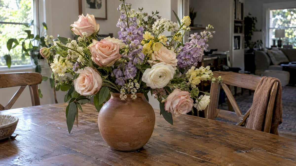 Pastel flower arrangement in a terracotta vase